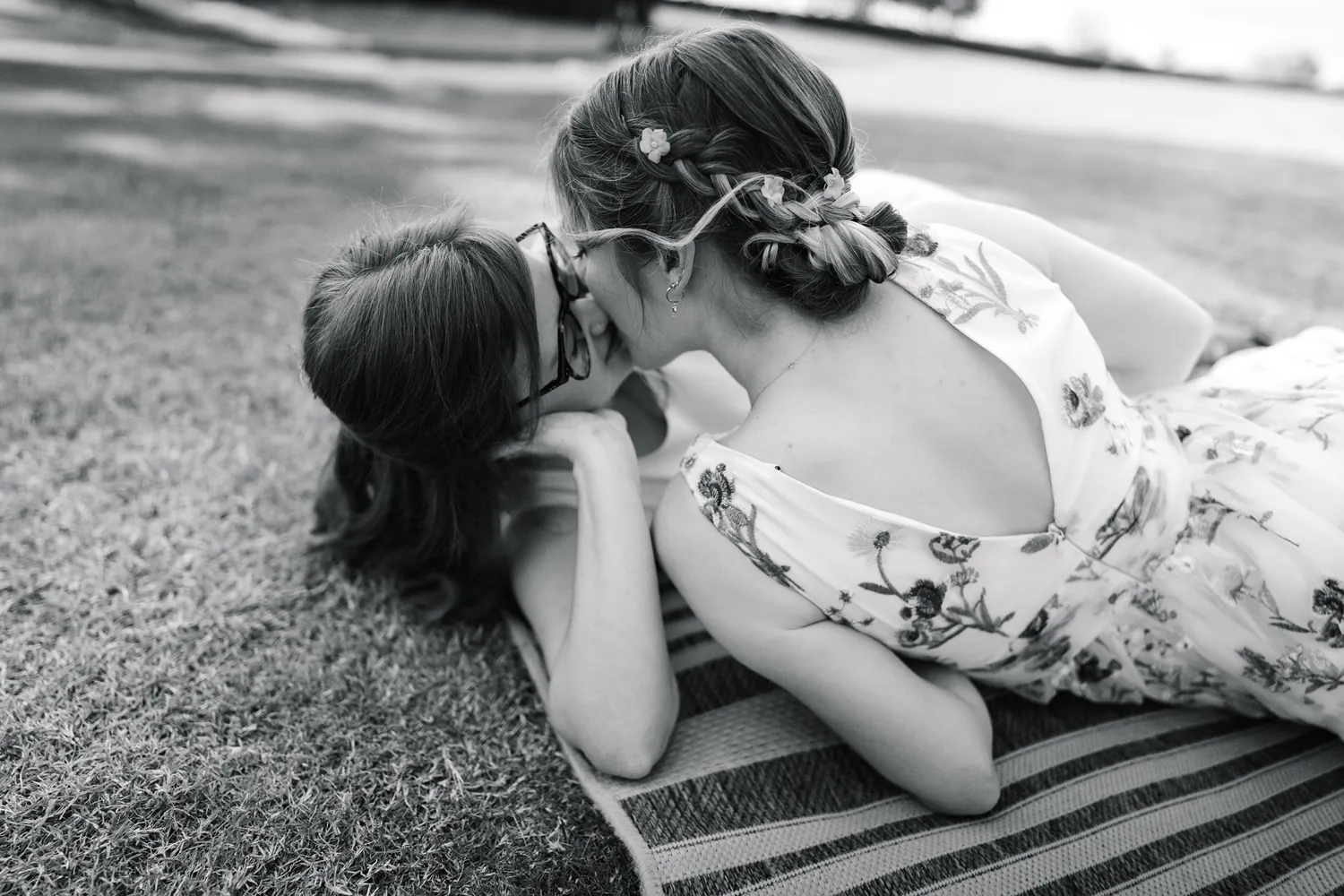 Black and White photo of Darcy and Kassidy kissing during their queer elopement at the Dallas Arboretum in Dallas, Texas