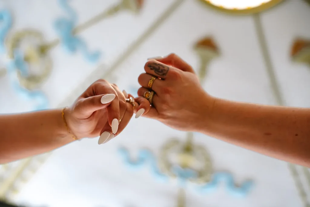 Close-up of hands with wedding rings during a queer LGBTQ elopement at the Fort Worth courthouse.